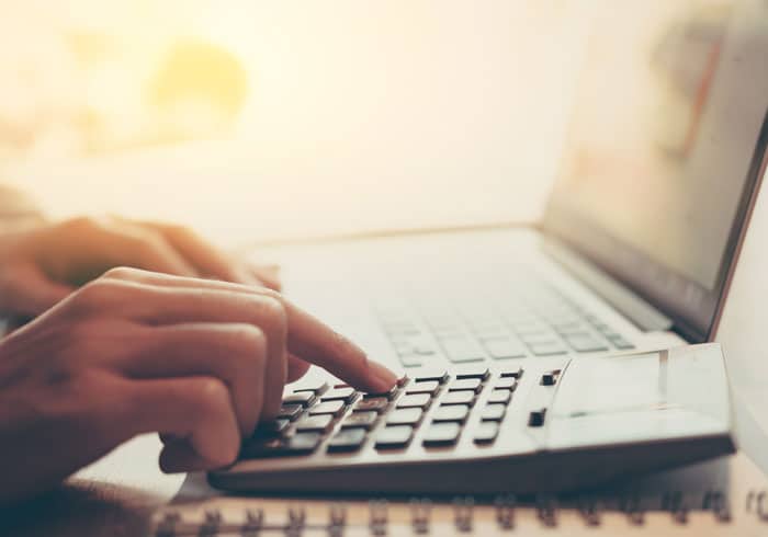 dental patient calculating the cost of the procedure Dana Point CA