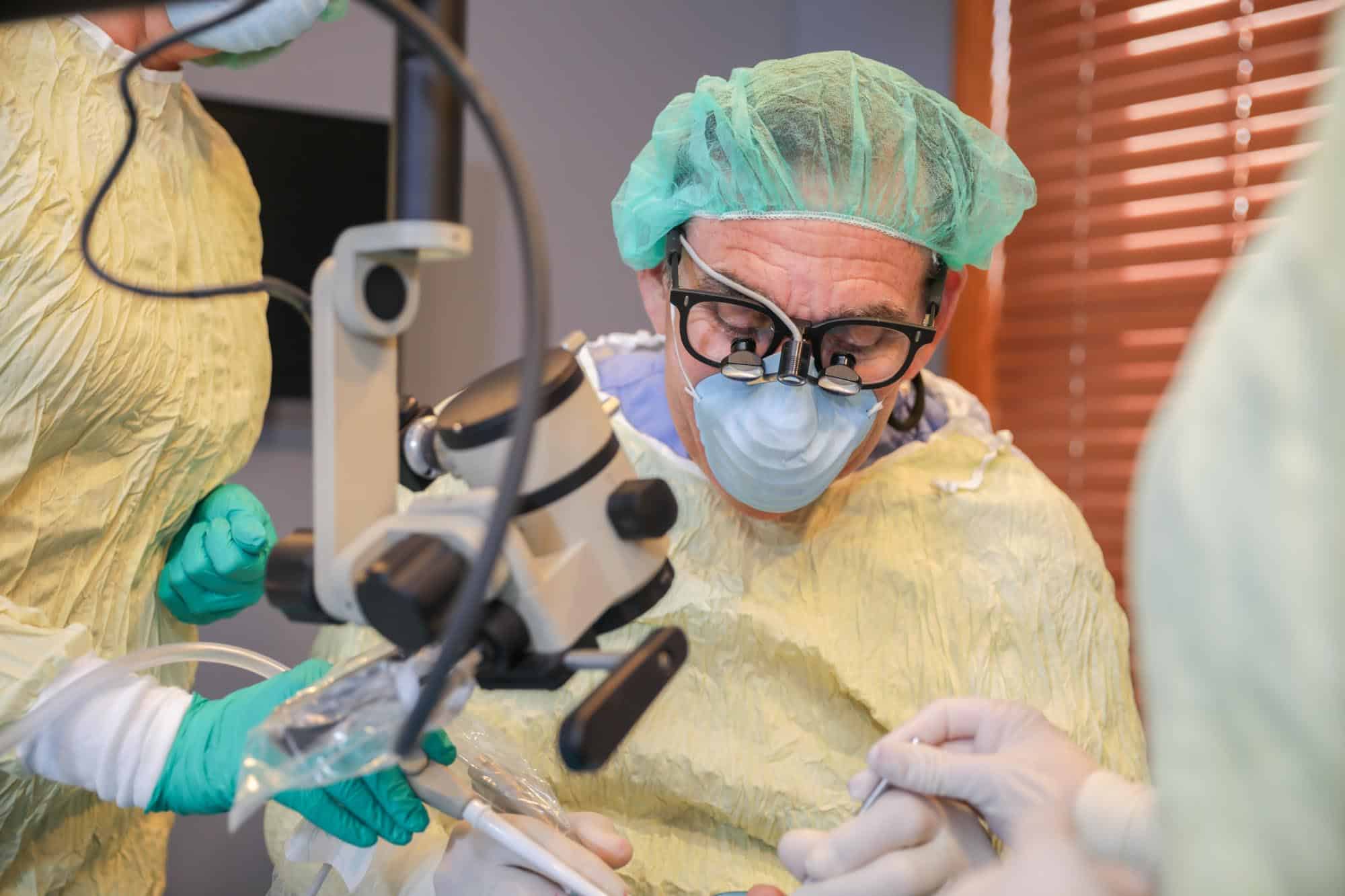 Dr. Alan Meltzer performing Dental Implant surgery