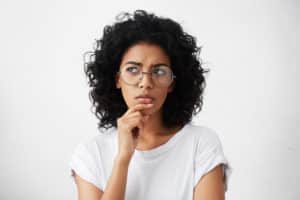 Questioning Dental Patient Wondering About Dental Implant Procedures
